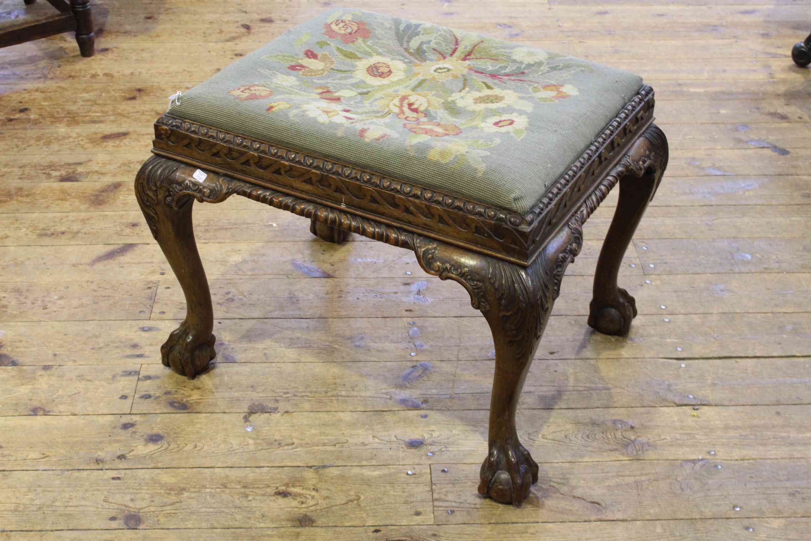 Carved mahogany ball and claw leg stool with tapestry seat, 46cm by 60cm.