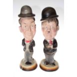 Pair of pottery Laurel and Hardy figures, 40cm.