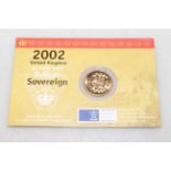 A 2002 Royal Mint Sovereign, 22 carat gold bullion, held within a sealed card and plastic wallet.