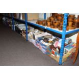 Twelve boxes of china, glass, soft toys, dolls, children's books, etc.