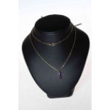 14 carat yellow gold chain with double amethyst pendant.