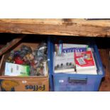 Box of McDonald's bagged toys and a box of military and reference books.