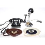 Four vintage telephones including G.E.C. and Besson.