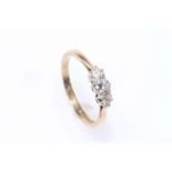 Three stone diamond ring set in 9 carat gold, size M.