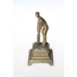 Brass cricketer figure, stamped reg no. 183761, 16cm.