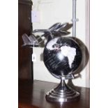 Chrome finish aviation globe or stand.