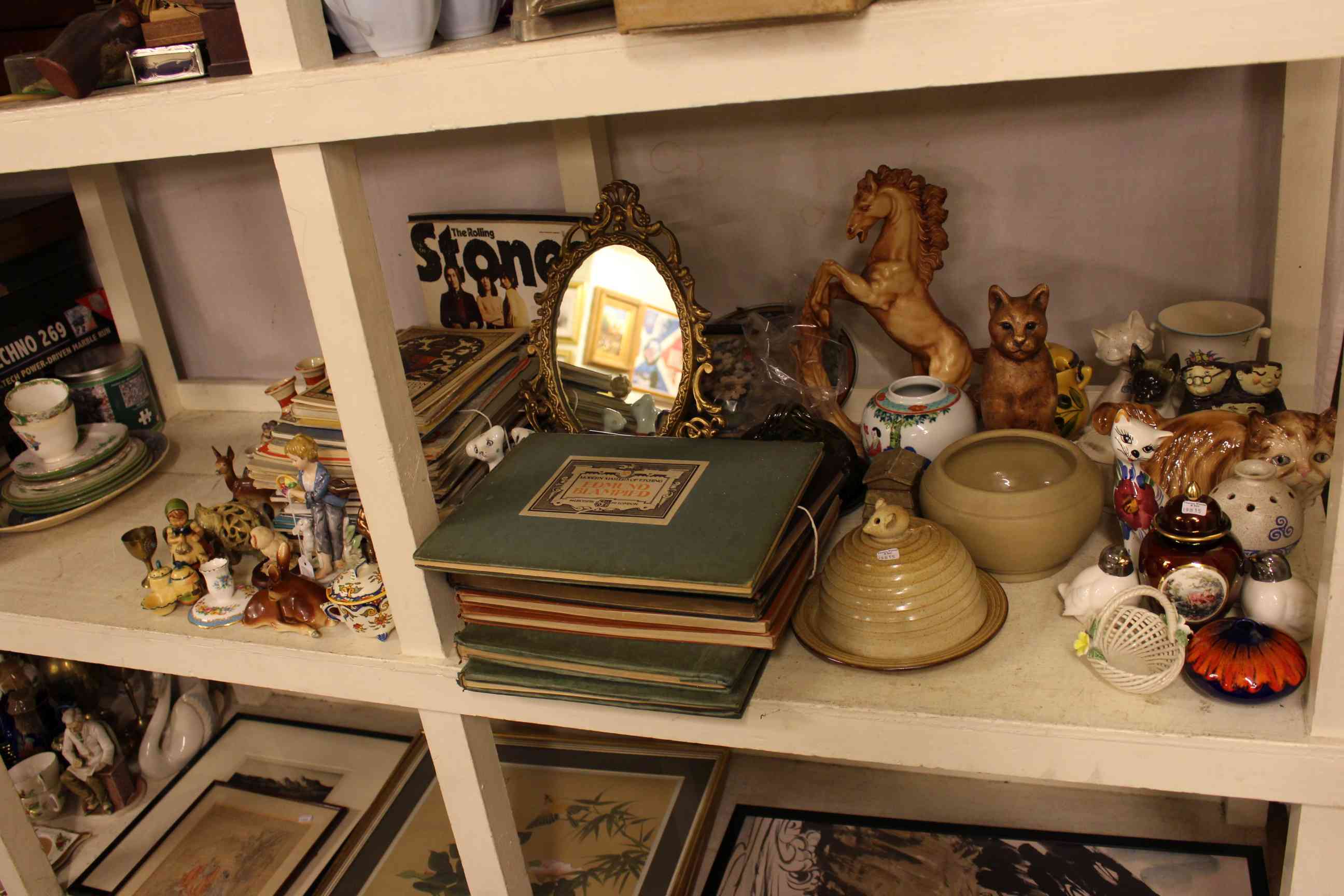 Shelf assortment including LP's, ceramics, punch, Edmund Blampied etchings, atlases, Royalty,