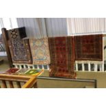 Collection of nine various Eastern rugs, prayer mats and carpet runner.