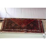 Persian design carpet with a red ground, 2.90 by 2.20.