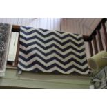 Contemporary blue and white chevron pattern rug, 1.70 by 1.20.