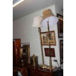 Two brass standard lamps with shades, brass coal bucket,poker and scuttle, gilt mirror,