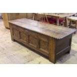 Large antique oak studded and inlaid coffer, 56cm by 179cm.