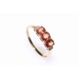 9 carat gold three pink/orange sapphire and diamond ring, size Y.