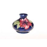 Moorcroft Pottery hibiscus vase, bearing warrant label, 10.5cm.