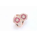 14 carat rose gold ruby and diamond ring featuring two round brilliant cut diamonds, approximate 0.