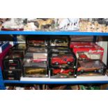 Collection of boxed Diecast vehicles and three fishing rods including Burago, Maisto, Guiloy.