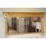 Victorian gilt framed overmantel mirror, 72cm by 146cm overall.