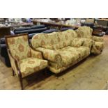 Three piece lounge suite in foliate pattern fabric.