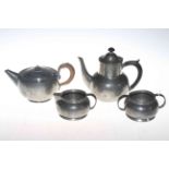 Liberty & Co. Tudric pewter three piece tea set, and a pewter teapot (4).