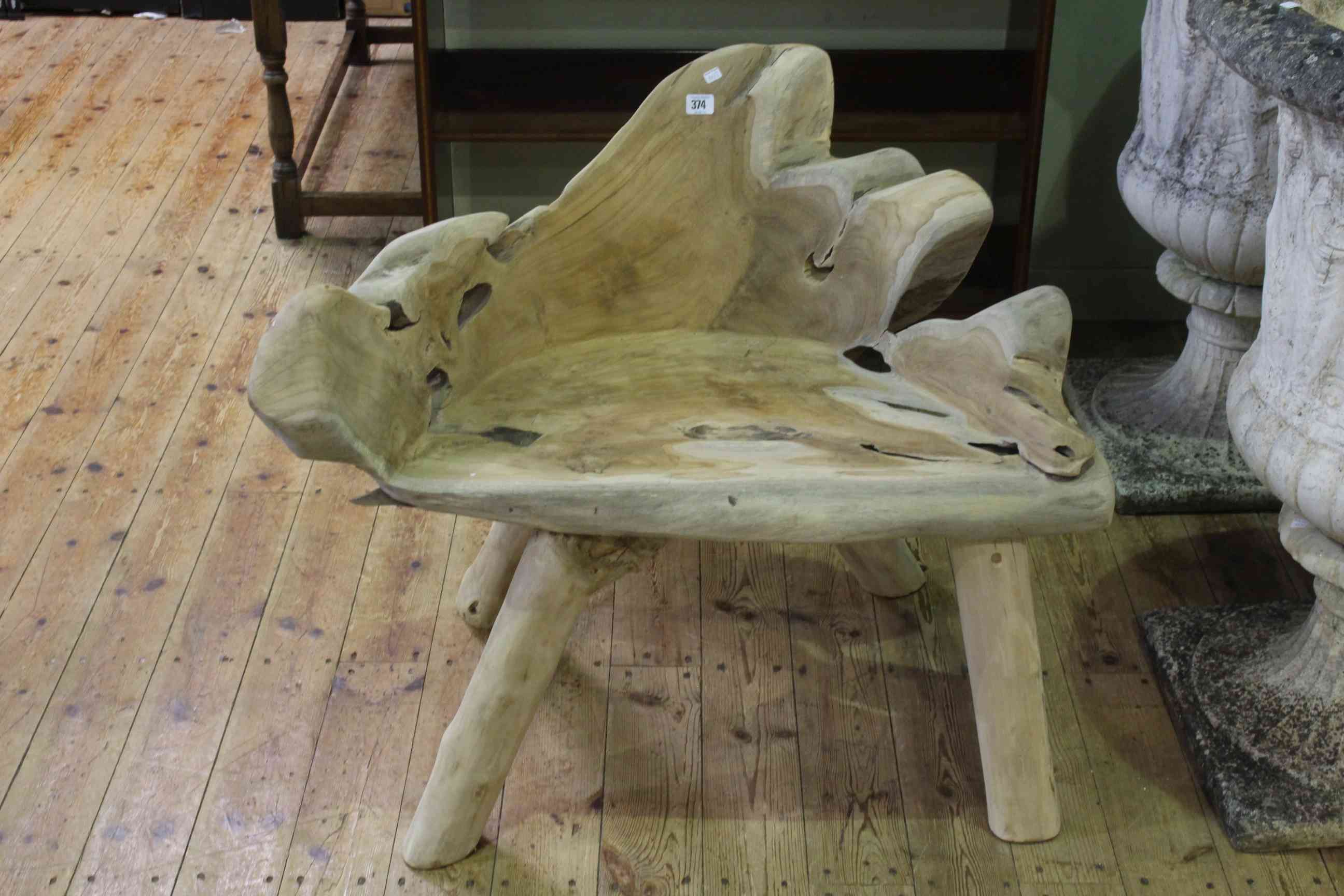 Arboreal teak garden seat, 75cm by 87cm.