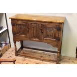 Oak linen fold panel two door side cabinet, 92cm by 106.5cm.