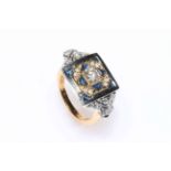 18 carat yellow and white gold sapphire and diamond ring featuring one round brilliant cut diamond,