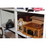 Modern record deck, sewing machine, wall clock, wicker basket, clock and violin with bows.