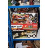Three boxed Scalextric including Mighty Metro, Pro Rally and Night Stages.