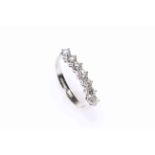 18 carat white gold seven stone diamond ring, size O, total diamond weight approximately 1.5 carats.