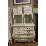 Painted bombé form five drawer chest and pair two drawer pedestals.