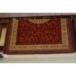 Abusson style carpet with a red ground 2.30 by 1.60.
