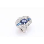 18 carat white gold tanzanite, sapphire and diamond ring featuring one oval cut tanzanite,