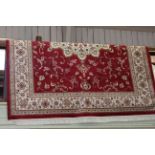 Keshan style carpet with a red ground 2.80 by 2.00.