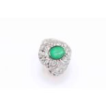 18 carat white gold, emerald and diamond ring, oval cut emerald bezel set, approximate 0.