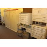 Nine pieces of white and gilt bedroom furniture including two wardrobes, two dressing tables,