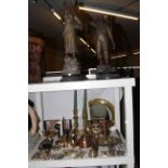 Pair of spelter figures, copper and brass including warming pan, horse brasses, candlesticks,