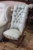 19th Century deep button mahogany framed rocking chair.