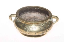 Chinese brass censor, decorated with figures, character mark to base, 14cm diameter.