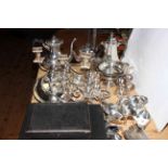 Collection of silver plate including teapots, candle holders and tureen.