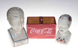 Two Phrenology heads and a Coca Cola box.