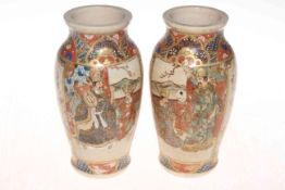 Pair of Japanese Meiji Period Satsuma vases, decorated with figures in landscapes, 18cm.