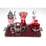 Five pieces of cranberry glass including decanter and vase.