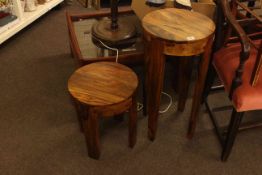 Two rosewood finish circular topped plant tables.