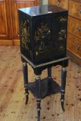 Ebonised Oriental decorated cabinet on stand,