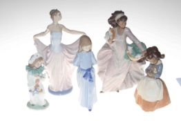 Five figurines including Lladro and Nao.