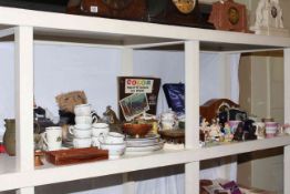 Shelf of ceramics, glass, mantel clock, napkin rings, vintage telephone, thimbles.