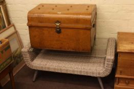 Rattan and glass topped coffee table and a tin trunk.