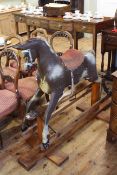 Child's rocking horse on pitch pine safety stand.