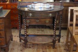 Oak demi lune hall table with bergere style back and undershelf raised on four barley twist legs.