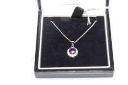 9 carat white gold, amethyst and diamond pendant with chain, boxed.